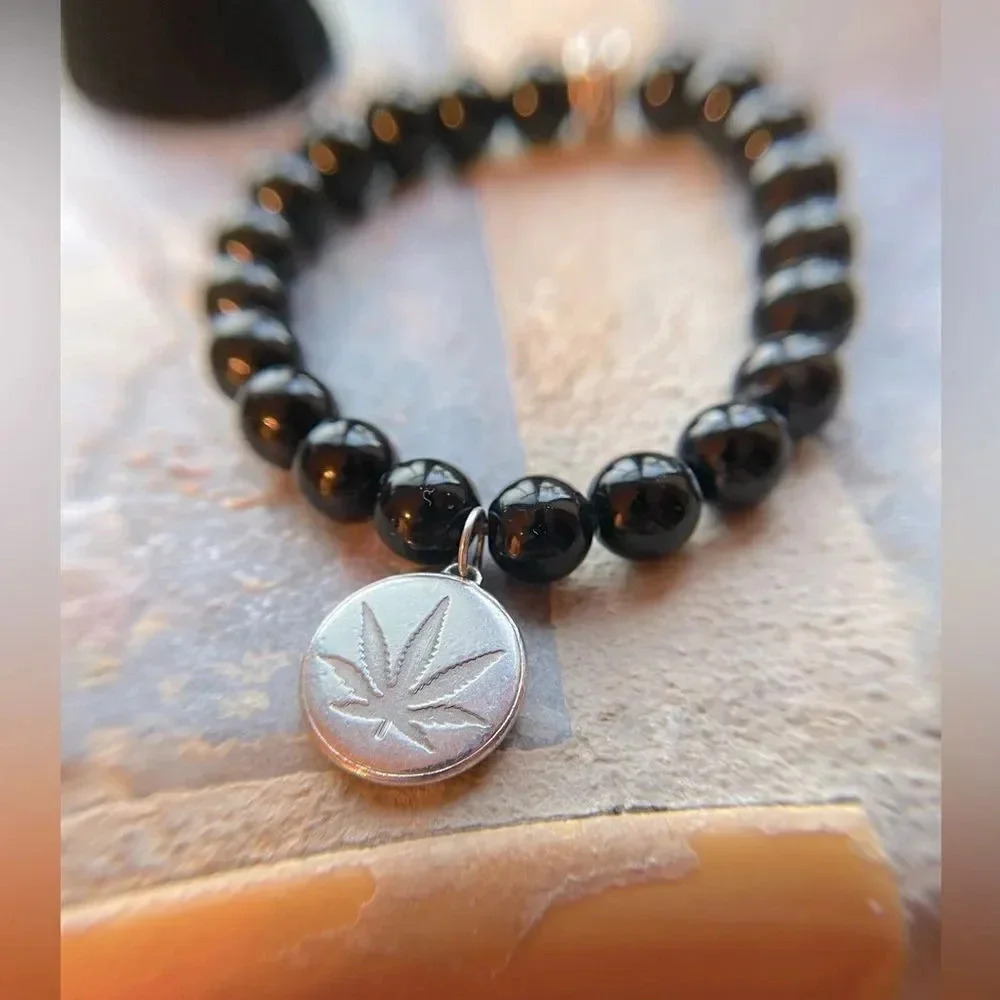 HIGH POINT JEWELRY BLACK ONYX BEADED
BRACELET STERLING SILVER SATIVA LEAF
CHARM